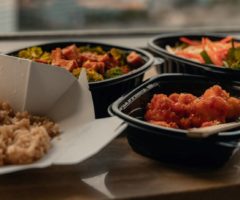 Containers of takeout food from a restaurant.