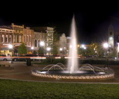 The Morgan Square fountain lit up at night in downtown Spartanburg.