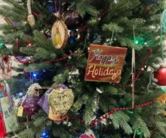 Handcrafted ornaments on a Christmas tree.